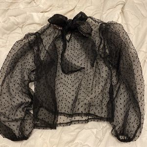 Sheer black polka dot puff sleeve top. Bow sits in the back, never worn